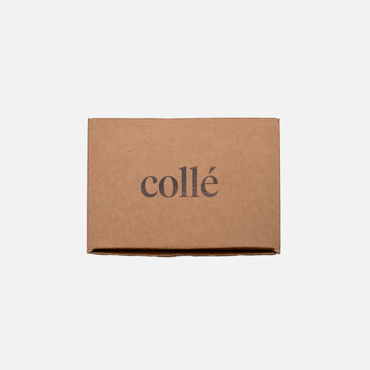 Brown cardboard box with 'Collé' branding on a white background